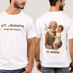 T-shirt Saint Joseph a mon dos<br><div class="desc">Une belle image traditionnelle de saint Joseph tenant l'Enfant Jésus avec des lys sur le dos. Texte humoristique sur le devant. Le texte et la police ci-dessous peuvent être modifiés.</div>