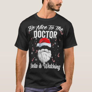 T-shirt Soyez gentil avec le docteur Père Noël regarde Xma