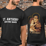 T-SHIRT ST. ANTHONY A MON DOS<br><div class="desc">Le texte "St. Anthony a mon dos" est sur le devant. Le dos a une image traditionnelle de saint Antoine de Padoue avec l'Enfant Jésus.</div>