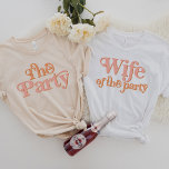 T-shirt TRIXIE Épouse rétro du groupe Party Bachelorette<br><div class="desc">Ce t-shirt "the party" est décoré d'une police rétro à thème des années 70, dans des tons blush et orange. Commandez l'option "femme du parti" blanche pour la future mariée et les chemises "la fête" orange coordonnatrice pour votre groupe de bachelorette. Les couleurs sont modifiables ! Cliquez sur "modifier la...</div>