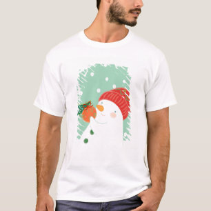 T-shirt Un bonhomme de neige accrochant un ornement sur un