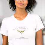 T-shirt Un Tini Un Peu Plus Ancien Martini<br><div class="desc">Un T-Shirt D'Anniversaire Tini Un Peu Plus Ancien. Ce design ludique est doté d'un verre à martini vert aquarelle avec olives au centre, associé à l'expression "A Tini Bit Older" en écriture courbe au-dessus du verre pour une ambiance amusante et décalée. Sous le verre à martini, le nom et l'âge...</div>
