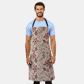 Tablier A person wears a floral-patterned apron  (Porté)