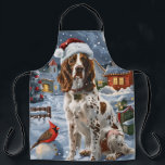 Tablier Anglais Setter Winter Wonderland Christmas Joy<br><div class="desc">Ce design festif reflète l'esprit joyeux de la période des fêtes, avec un adorable petit portant un chapeau de Père Noël. Le chien est niché dans un pays des merveilles hivernales, avec un bonhomme de neige, un sapin de Noël décoré et des cadeaux joliment emballés. Les flocons de neige tombent...</div>