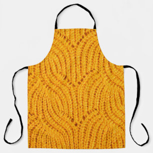 Tablier Chandail en tricot orange, arrière - plan texturé.