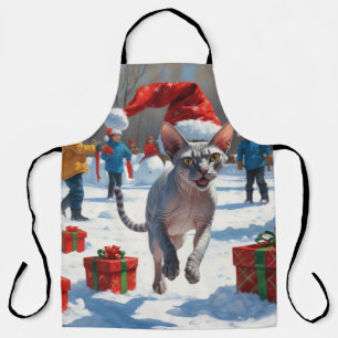 Tablier Chat Sphynx courant dans la neige avec un chapeau