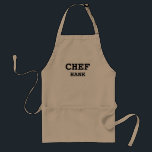 Tablier Chef Cuisine Mens Personnalisé<br><div class="desc">Cuire avec style avec ce Chef Cuisine Mens Adulte Personnalisé Apron Adulte. C'est un design moderne et simple avec le texte "chef" en lettres noires en gras sur le centre avant. Le nom est en lettres plus petites appariées sous le chef. CLIQUEZ SUR PERSONNALISER L'OPTION MODÈLE ET ENTRER LE NOM...</div>