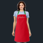 Tablier Custom Red Christmas Simple Elegant Nom du script<br><div class="desc">Connaissez-vous quelqu'un qui aimerait un tablier personnalisé en cuisinant ces friandises, cuisinant de délicieux plats aux couleurs des vacances (rouge et vert). Un cadeau parfait pour encourager ses talents pendant les vacances. Script noir pour le nom avec des embellissements à queue longue. Conseil Pro : gardez le petit carré pour...</div>