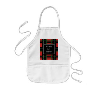 Tablier de la cuisson du petit enfant de l'aide de
