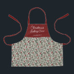 Tablier Équipement de cuisson de Noël à la florale pour en<br><div class="desc">Ce magnifique tablier de Noël est orné d'un motif floral et verdoyant dessiné à la main dans des couleurs classiques et traditionnelles de Noël, vert foncé, rouge bordeaux, et ivoire sur un arrière - plan beige de sable. La typographie de script est simple : "Christmas Baking Crew", et un modèle...</div>