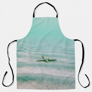 Tablier Estarfish blanche sur sable sous l'eau le matin