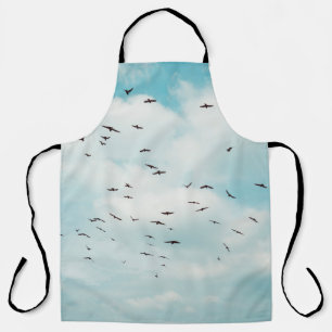 Tablier Flock of grey dove fly on vintage blue sky. above,