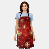 Tablier Flocons de neige dorés de Noël sur fond rouge (Porté)