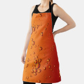 Tablier gouttelettes d'eau sur la surface orange (Insitu)