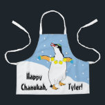 Tablier Heureux Chanukah Penguin Apron<br><div class="desc">Heureux Chanukah Penguin Apron. Personnalisez en supprimant du texte et en ajoutant le vôtre. Utilisez votre style de police, votre couleur et votre taille préférés. Assurez-vous de choisir la taille et la couleur de la sangle. Tous les éléments de conception peuvent être transférés à d'autres produits Zazzle et édités. Heureux...</div>