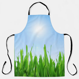 Tablier Jardin à l'herbe verte avec conception de ciel ble