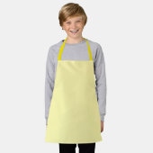 Tablier jaune clair présentant un design simple et (Porté)