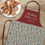 Tablier Joli motif floral Noël Cuisinière de Noël | Nom<br><div class="desc">Ce magnifique tablier de Noël est orné d'un motif floral et verdoyant dessiné à la main dans des couleurs classiques et traditionnelles de Noël, vert foncé, rouge bordeaux, et ivoire sur un arrière - plan beige de sable. La typographie de script est simple : "Christmas Baking Crew", et un modèle...</div>