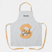 Tablier Monogramme initial majuscule orange en script (Recto)
