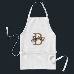 Tablier Monogramme moderne élégant Nom Black Gold Script<br><div class="desc">Le Monogramme moderne élégant Nom Black Gold Script Adult Apron sonne comme un ajout sophistiqué et élégant à toute cuisine ou espace de travail. Cet tablier pourrait comporter une base noire classique avec un élégant script or pour le monogramme et le nom, ajoutant une touche luxueuse et personnalisée. Il est...</div>