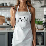 Tablier Monogramme noir minimal<br><div class="desc">Élevez votre style de cuisine avec cet tablier minimaliste noir Monogramme. Doté d'un design épuré et simple, cet tablier allie fonctionnalité et élégance, ce qui en fait l'endroit idéal pour les cuisiniers et les chefs professionnels. Le monogramme personnalisable ajoute une touche personnelle, assurant que vous cuisinez dans le style. Fabriqué...</div>