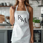 Tablier Monogramme noir minimal<br><div class="desc">Élevez votre style de cuisine avec cet tablier minimaliste noir Monogramme. Doté d'un design épuré et simple, cet tablier allie fonctionnalité et élégance, ce qui en fait l'endroit idéal pour les cuisiniers et les chefs professionnels. Le monogramme personnalisable ajoute une touche personnelle, assurant que vous cuisinez dans le style. Fabriqué...</div>