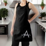 Tablier Noir Argent moderne Script Girl Monogramme Nom<br><div class="desc">Nom du monogramme noir et argent Apron. Cela rend le cadeau parfait pour 16 ans,  mariage,  douche nuptiale,  anniversaire,  baby shower ou bachelorette pour quelqu'un qui aime le luxe glam et les styles chic.</div>