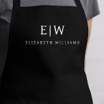 Tablier Noir Élégant Moderne Minimaliste Nom Monogramme<br><div class="desc">Appréciez votre expérience culinaire grâce à notre Apron de Cuisine Monogramme minimaliste Moderne Classique. Cette cuisine indispensable allie élégance intemporelle et minimalisme contemporain. Conçu avec précision, cet tablier n'est pas seulement un accessoire pratique, mais aussi un énoncé de style personnel. Le monogramme personnalisable et l'option de nom vous permettent d'imprégner...</div>