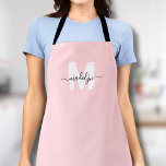 Tablier Nom du monogramme Élégant rose pâle minimal<br><div class="desc">Personnalisé Blush rose Personnalisé Nom initial Monogram Apron. Ce tablier féminin et féminin est parfait pour ajouter une touche personnelle et élégante à vos vêtements de travail. Que vous soyez fleuriste, coiffeur dans le salon, chef cuisinier fouettant des créations dans la cuisine, cet espace allie élégance et fonctionnalité pour tout...</div>