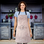Tablier parties scintillant or rose goutte nom monogramme<br><div class="desc">Un arrière - plan d'or rose décoré d'or rose,  de faux gouttes de parties scintillant rose étincelante,  de la peinture goutte à goutte. Personnalisez et ajoutez vos initiales et votre nom de monogramme.</div>