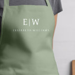 Tablier Sage Green Élégant Moderne Minimaliste Monogramme<br><div class="desc">Appréciez votre expérience culinaire grâce à notre Apron de Cuisine Monogramme minimaliste Moderne Classique. Cette cuisine indispensable allie élégance intemporelle et minimalisme contemporain. Conçu avec précision, cet tablier n'est pas seulement un accessoire pratique, mais aussi un énoncé de style personnel. Le monogramme personnalisable et l'option de nom vous permettent d'imprégner...</div>