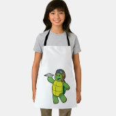 Tablier Tortue comme pilote avec avion en papier (Insitu)