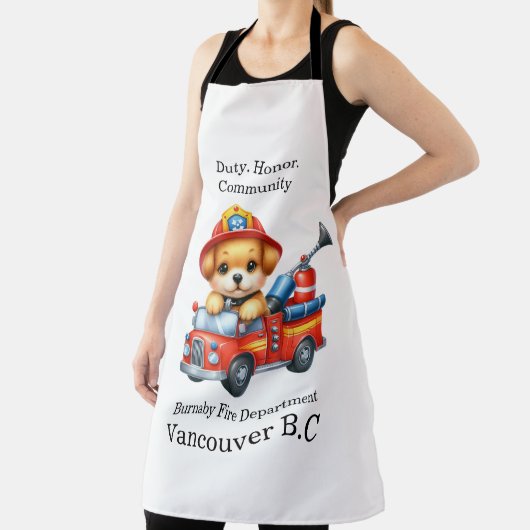 Tablier Un pompier à chiot mignon conduit un camion miniat (Insitu)