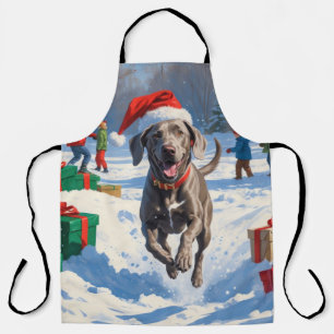 Tablier Weimaraner courant dans la neige avec un chapeau d