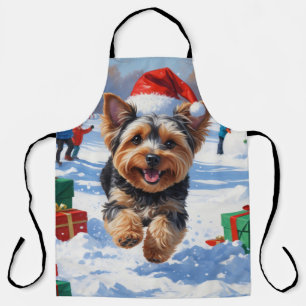 Tablier Yorkipoo courant dans la neige avec un chapeau de
