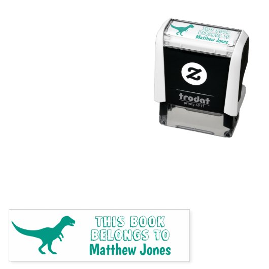 Tampon Auto-encreur CE LIVRE APPARTIENT AU dinosaure t-rex de l'élève (En situation)