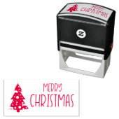 Tampon Auto-encreur Joyeux texte de Noël avec arbre de Noël neigeux (En situation)
