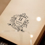 Tampon Auto-encreur Livre personnalisé avec monogramme de crête Ex Lib<br><div class="desc">Conception de tampon encreur avec un blason de style vintage avec votre monogramme personnalisé et votre nom dans une typographie serif classique. Le cadre orné est entouré d'une composition florale de roses et de feuilles botaniques. Sous le blason, il y a un ruban ou une banderole avec "Ex Libris" incurvé...</div>