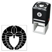 TAMPON AUTO-ENCREUR  SYMBOLE JAUNE (KAMON) (En situation)