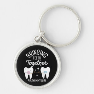 Tanden bij elkaar brengen - orthodontist sleutelhanger