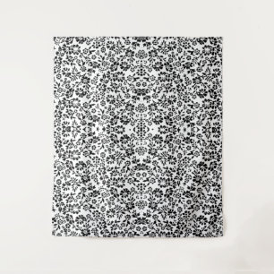 Tapijtdeken met een zwarte en witte bloemen. wandkleed
