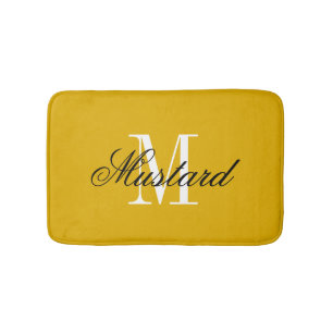 Tapis de bain jaune moutarde avec monogramme de no