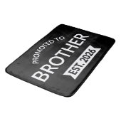 Tapis De Bain Promu À Frère Est. 2026 II (Angle)