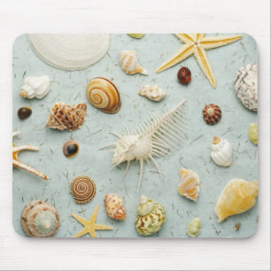 Tapis De Souris Coquillages assortis sur l'arrière - plan bleu