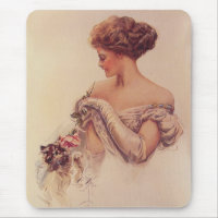 Jolie femme tenant un chaton (par Harrison Fisher)