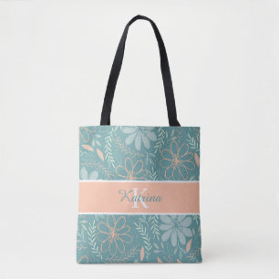 Tas met geborduurde bloemen en monogram