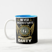 Tasse 2 Couleurs Never Underestimate The Power Of A Guity (Gauche)