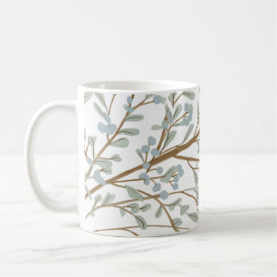 tasse à café avec feuilles et branches d'arbres