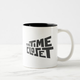 Tasse à deux tons de logo de cabinet de temps