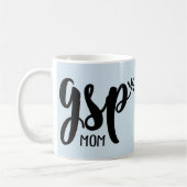 Tasse allemande de maman d'indicateur aux cheveux (Gauche)